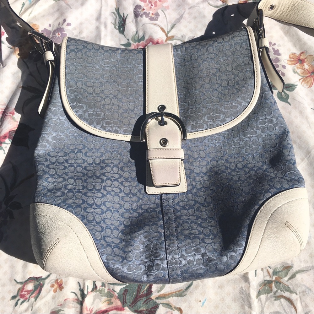 baby blue buckle coach purse with white detail